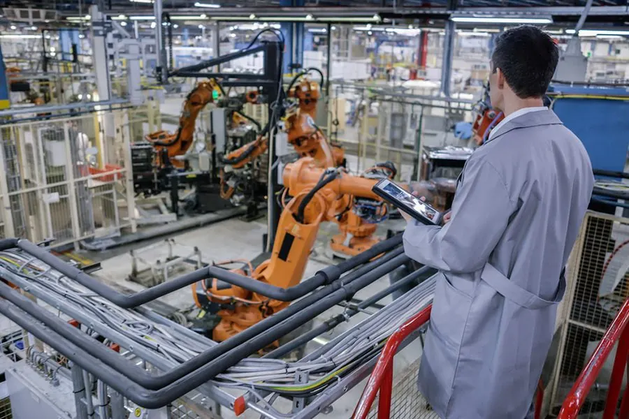 Engineer reviewing manufacturing data